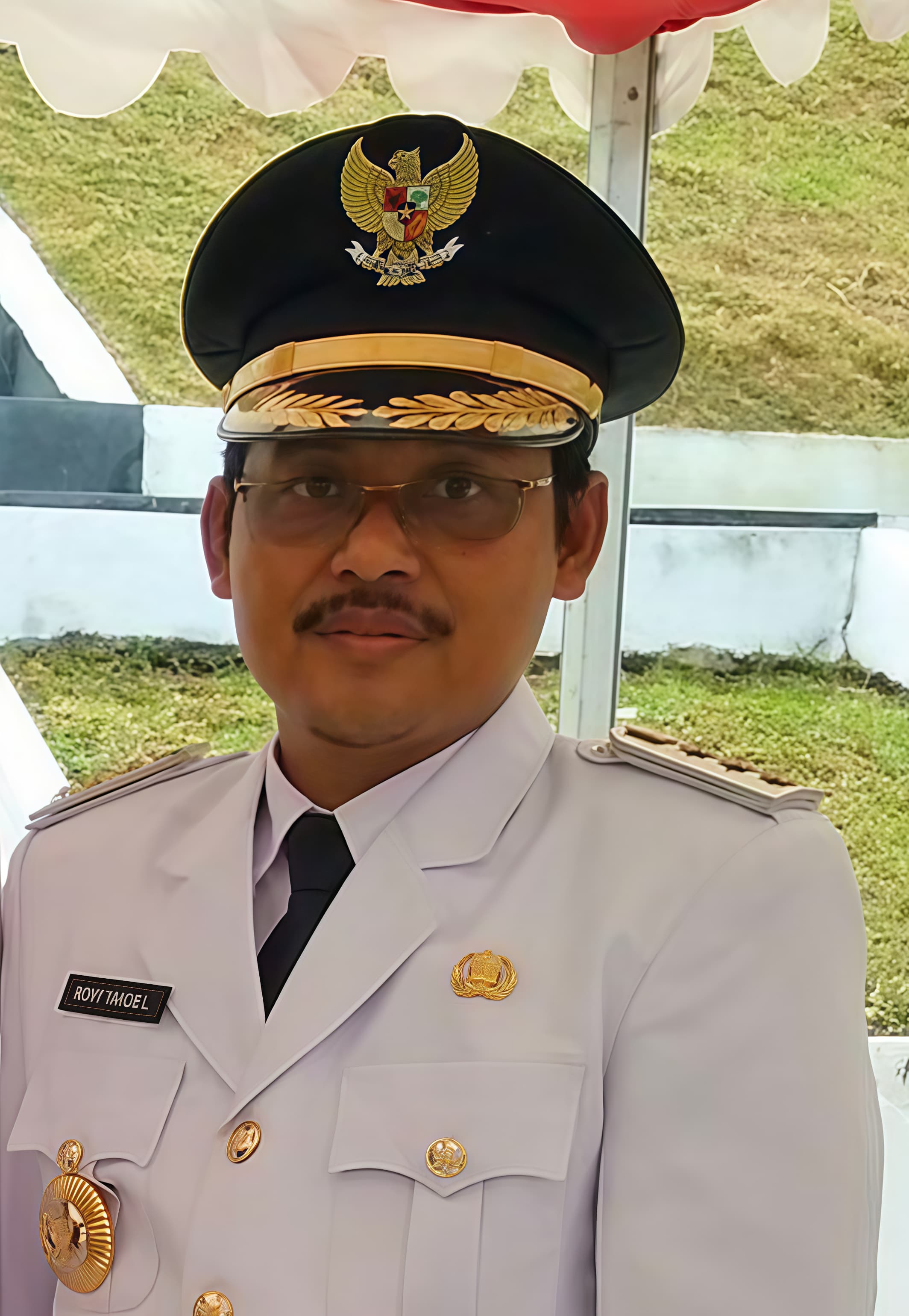 Dr. Drs. Roni Yakob Laute, M.Si